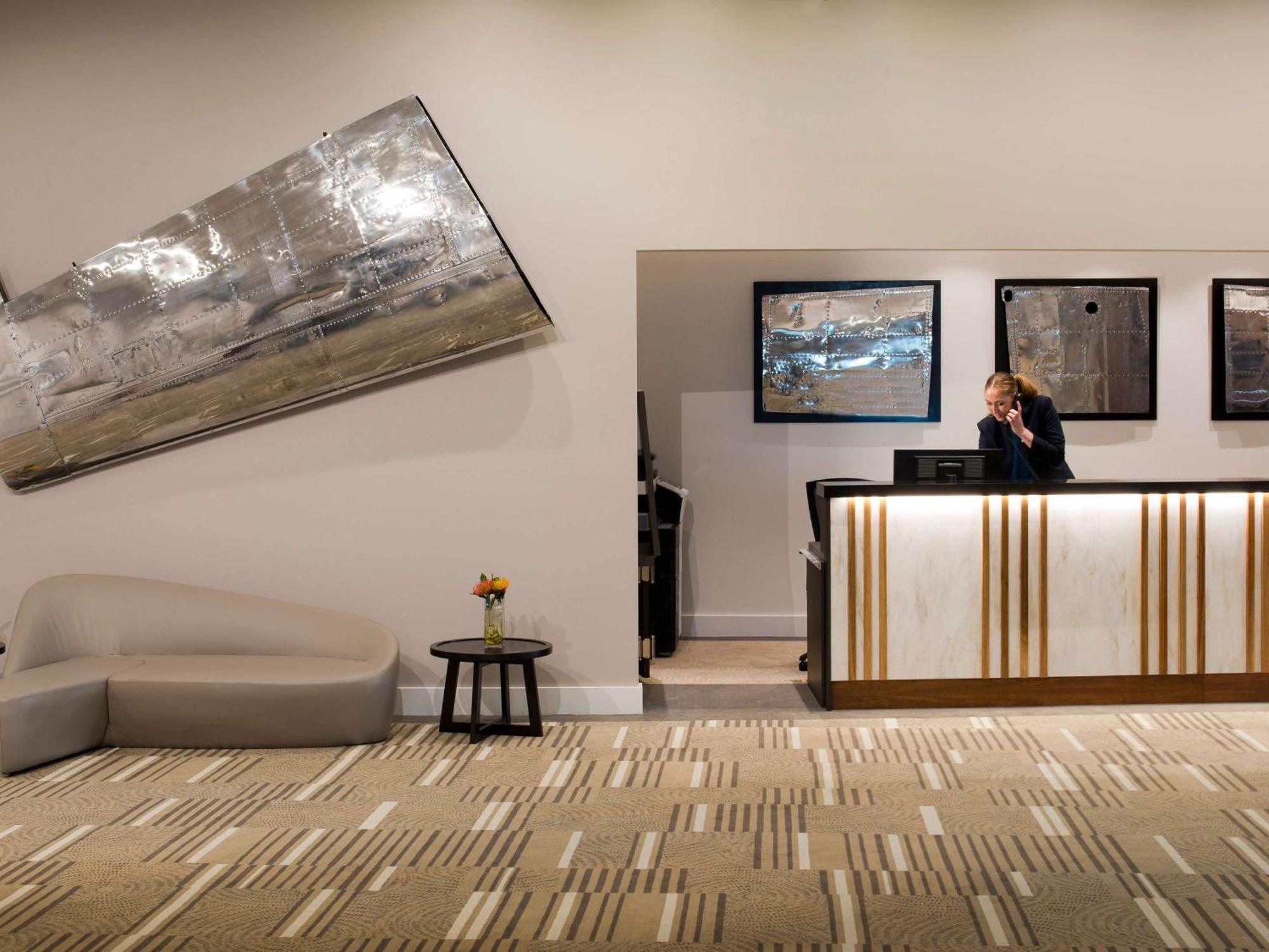 Отель Pullman Brisbane Airport Экстерьер фото The reception area at the hotel